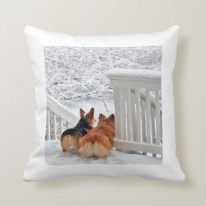 Corgis in the snow throw pillow
