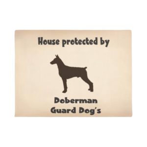House protected by Doberman guard Dogs. Doormat